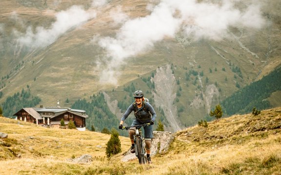 Annika Jeschke rides a mountain bike in the mountains