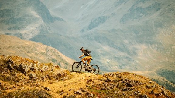 Cyclist riding uphill on a mountain